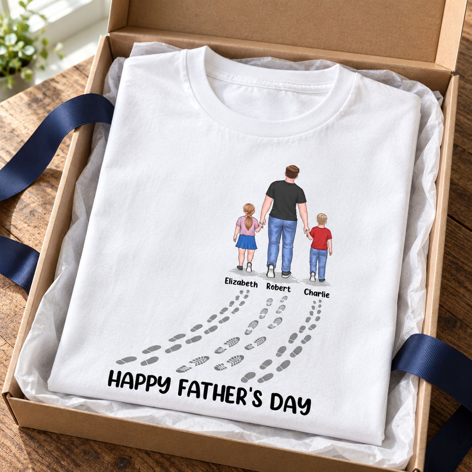 Fathers And Childs Footprints Personalized T-Shirt folded in a gift box with ribbon