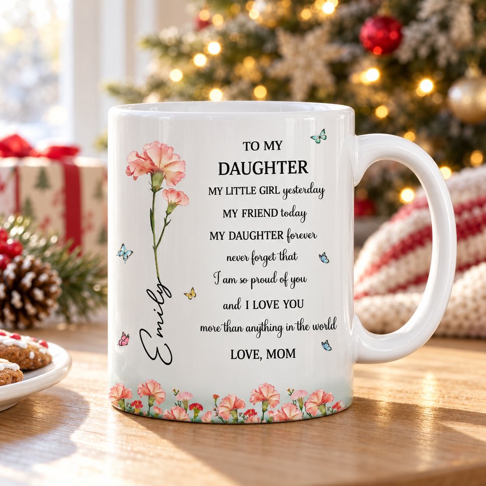 Personalized birth flower daughter ceramic mug on table by Christmas tree