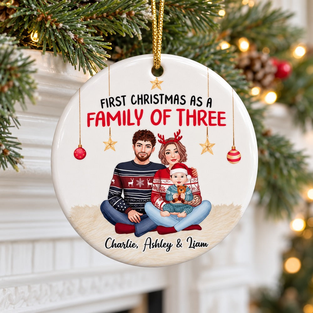 Personalized family of three ceramic ornament hanging from an evergreen mantel garland