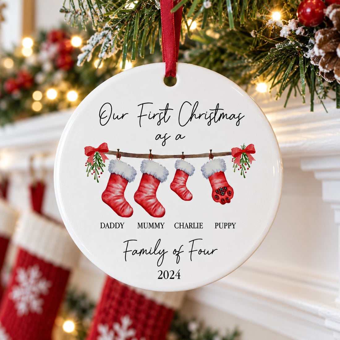 Personalized family with pet ceramic ornament hanging on a festive Christmas fireplace mantel