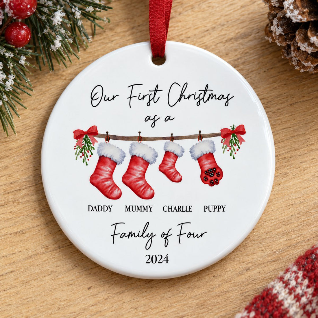 Close-up detail of glossy ceramic ornament surface and watercolor family stockings print
