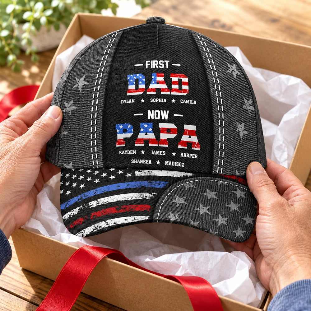 Unwrapping First Dad Now Papa personalized baseball cap from a holiday gift box