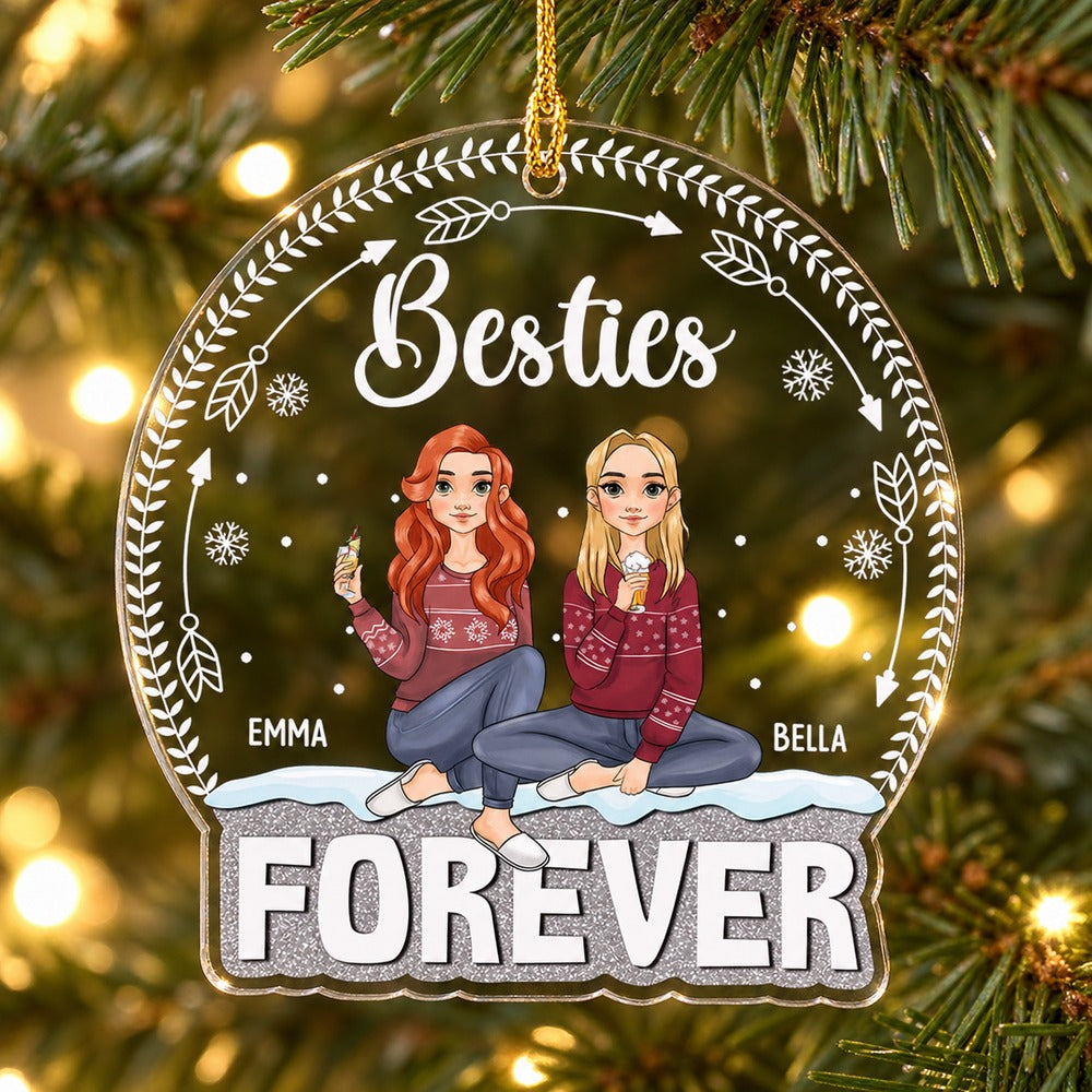 Personalized Besties Forever acrylic ornament with Emma and Bella hanging on a bright Christmas tree branch