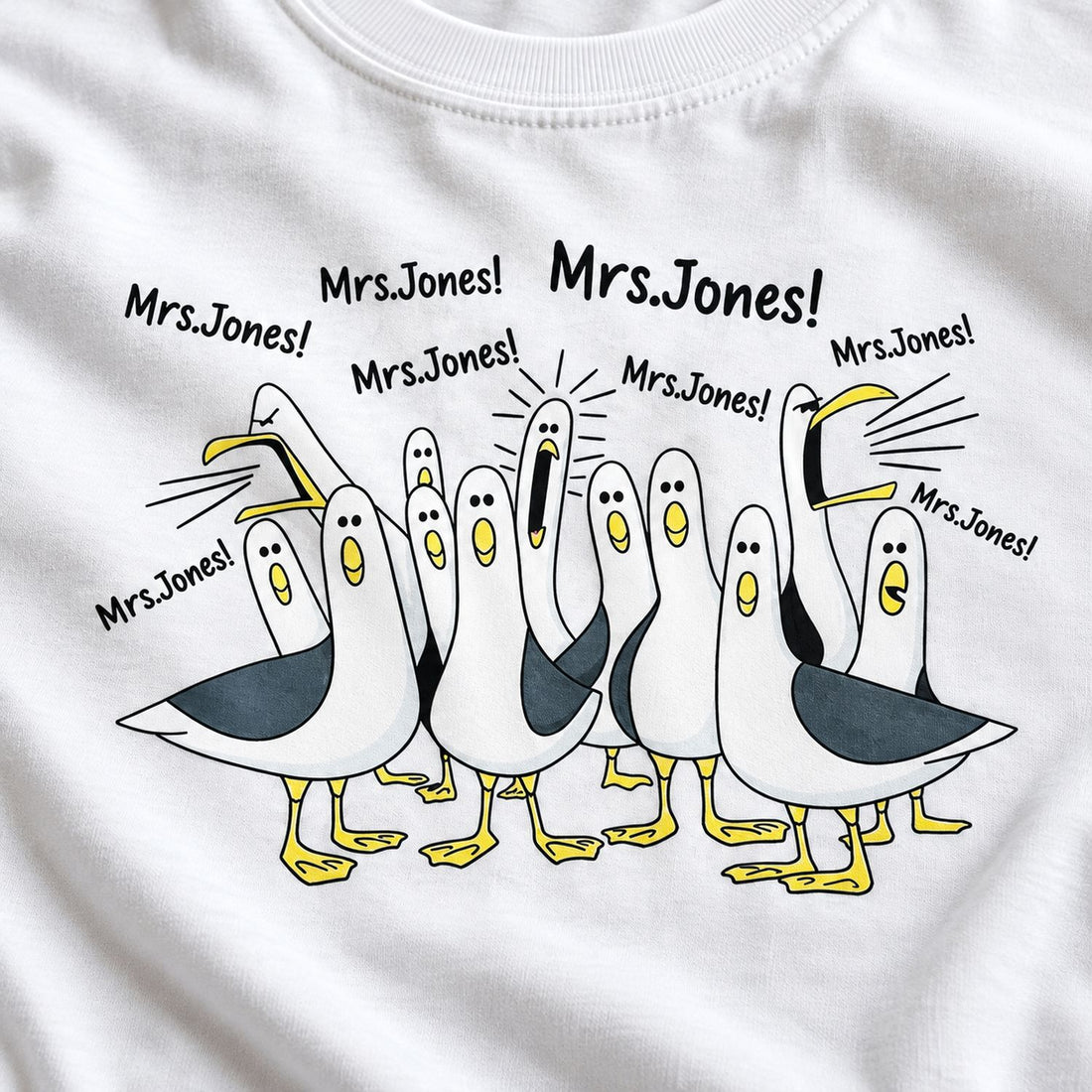 Close-up detail of funny seagulls calling teacher print on white cotton t-shirt fabric
