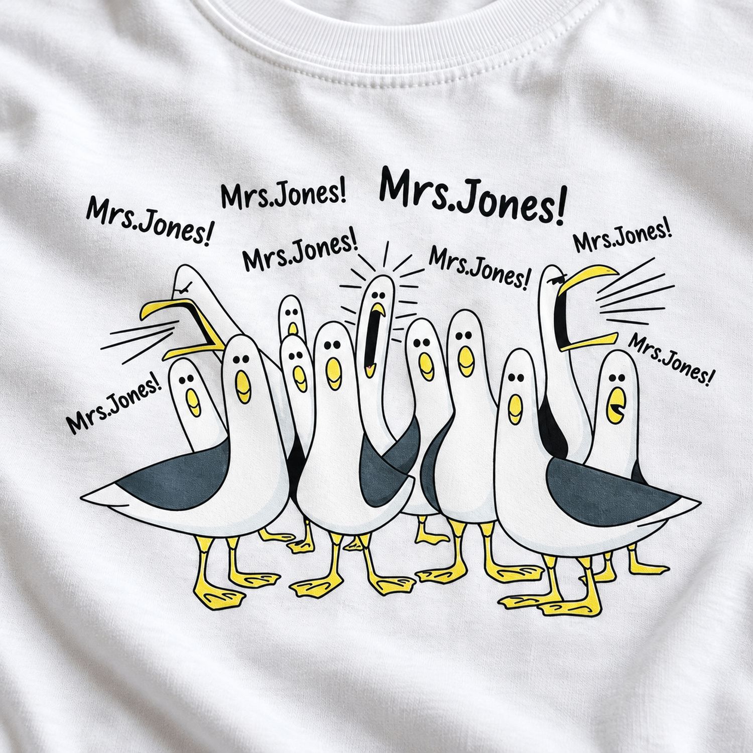 Close-up detail of funny seagulls calling teacher print on white cotton t-shirt fabric