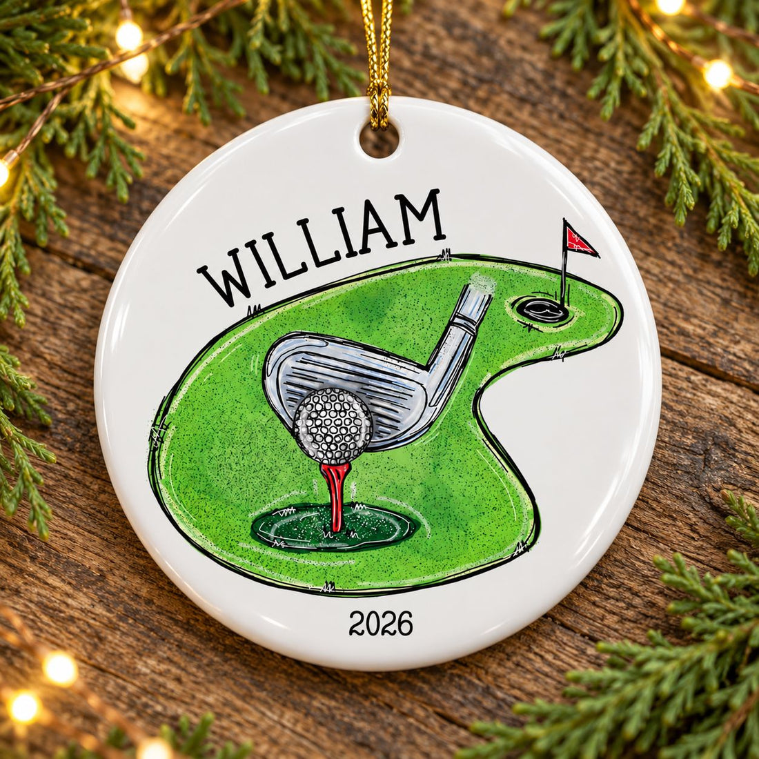 Golf lover Christmas ceramic ornament flat on rustic wood with soft cedar sprigs