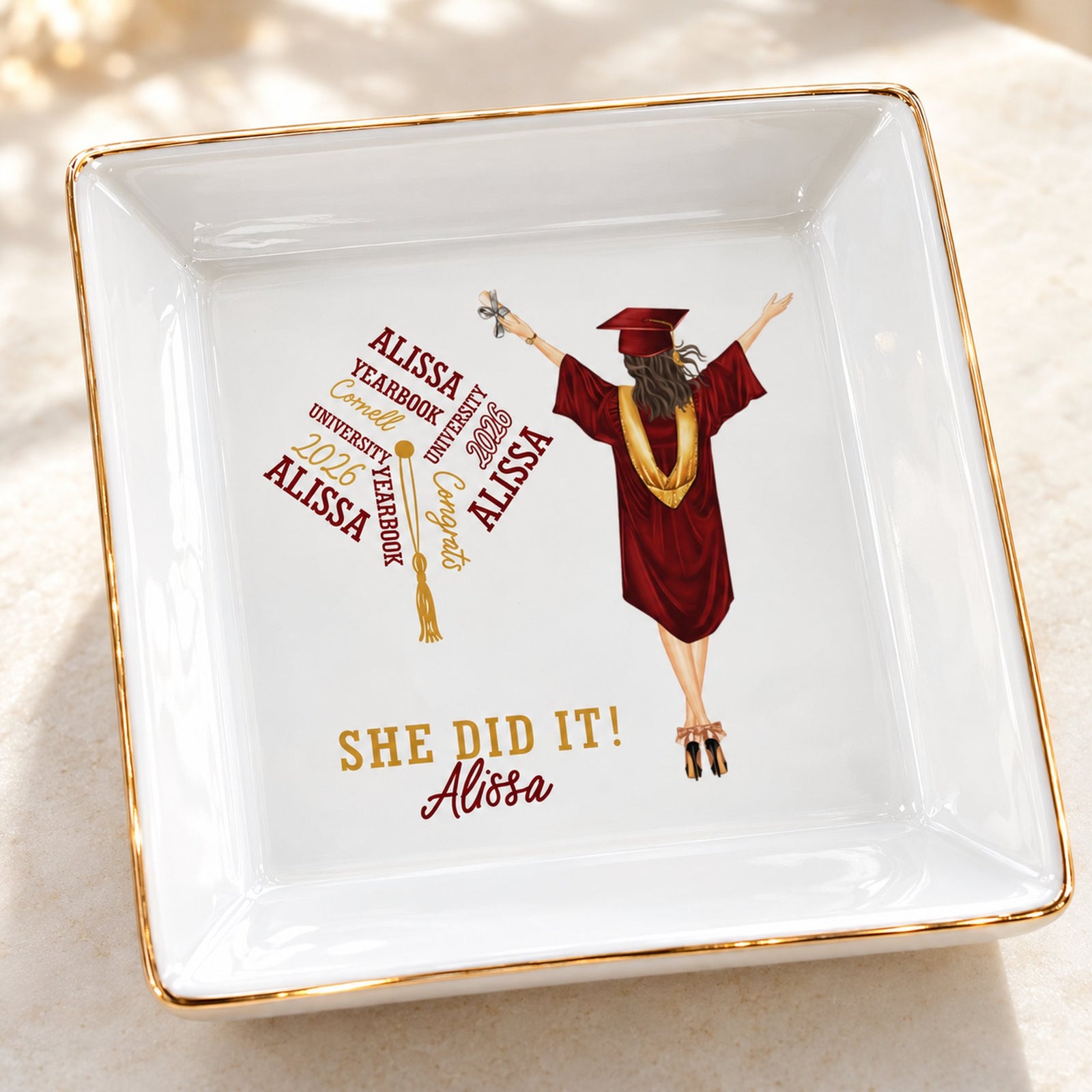 Close-up detail of personalized graduation ceramic jewelry dish print and gold rim