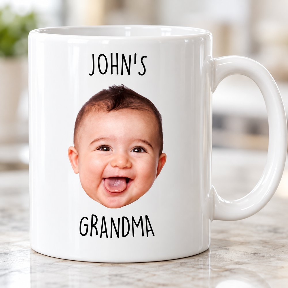 Close up detail of custom printed baby face and text on glossy white ceramic mug