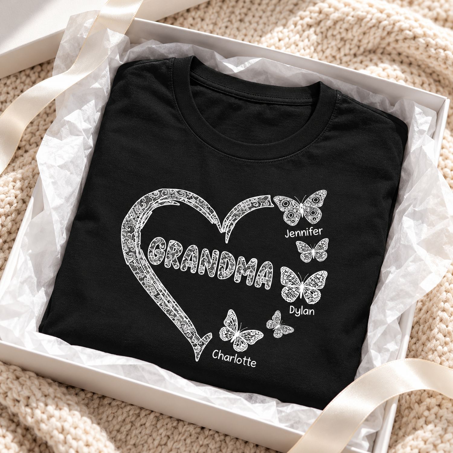Personalized Grandma butterfly heart t-shirt folded in a holiday gift box with ribbon