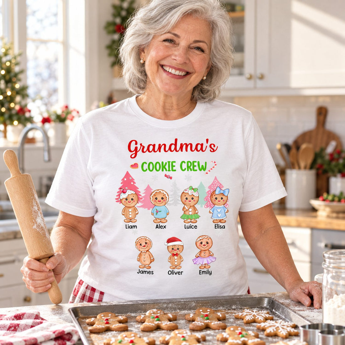 Grandma wearing personalized Grandma's Cookie Crew Christmas t-shirt in a bright kitchen