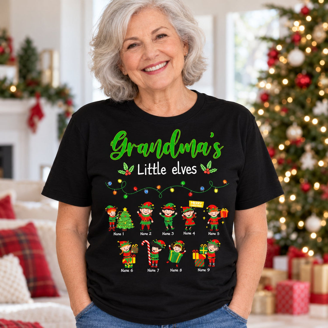 Grandma wearing personalized Grandma's Little Elves black Christmas t-shirt in festive living room