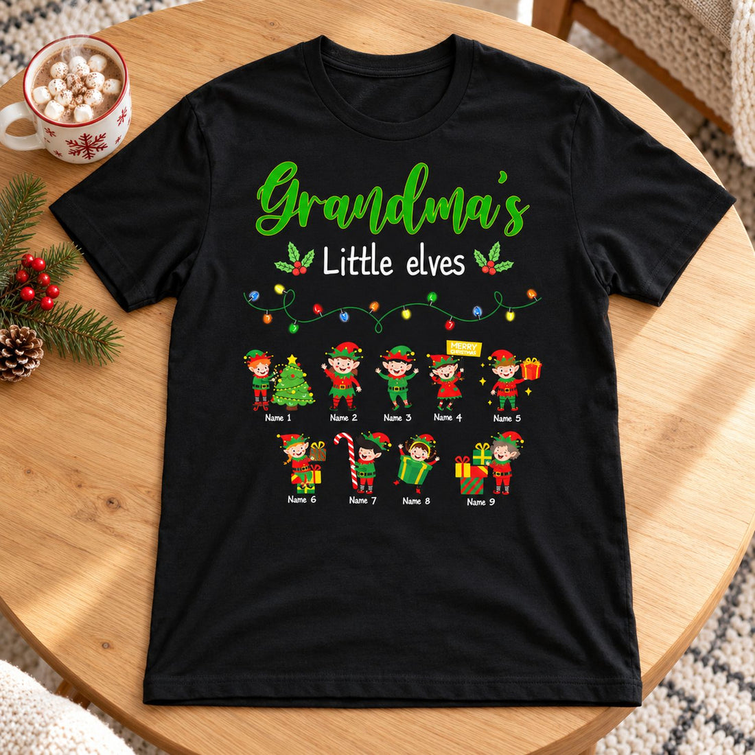 Personalized Grandma's Little Elves Christmas t-shirt laid flat with holiday decor