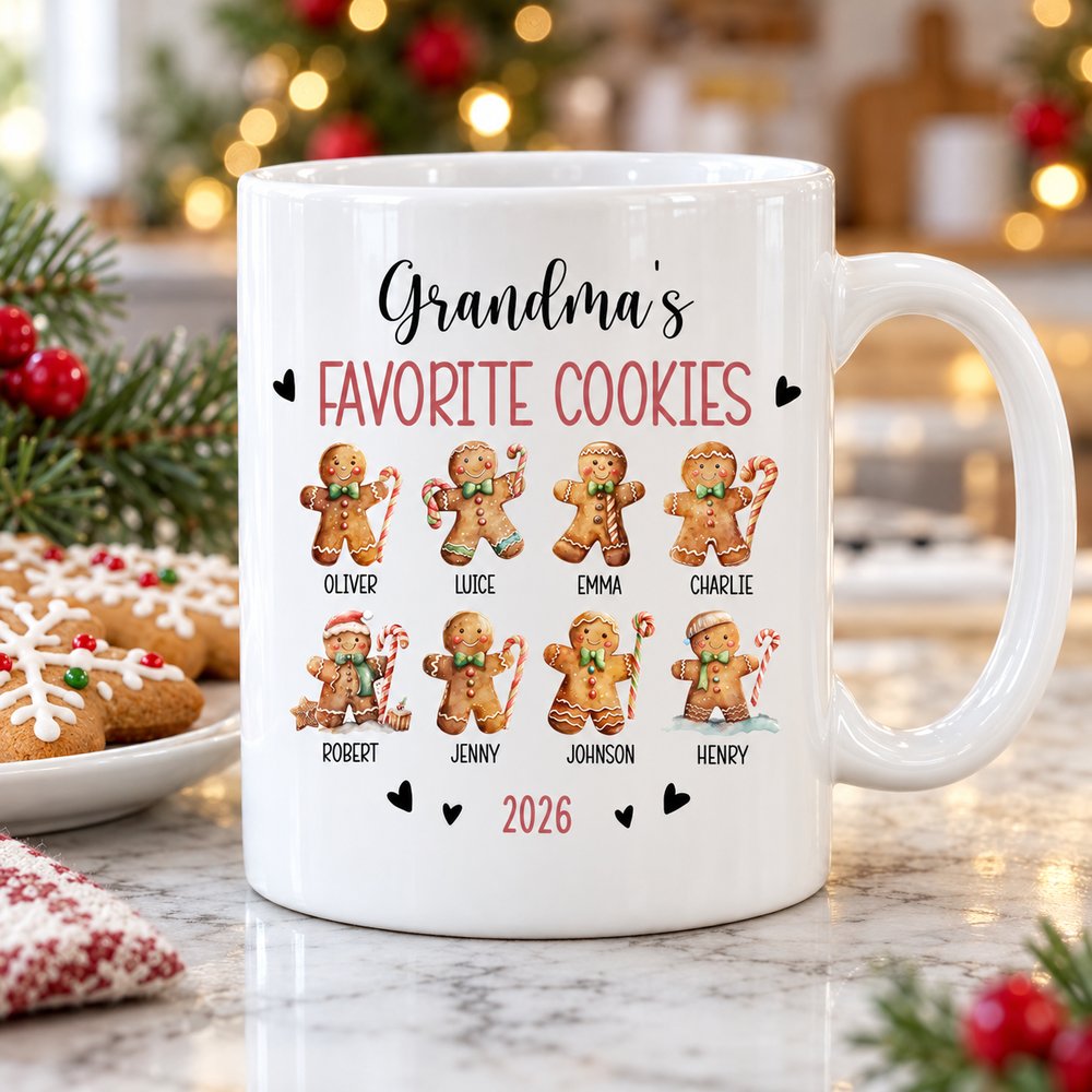 Personalized Grandmas Favorite Cookies mug on a kitchen counter with gingerbread cookies and pine sprig