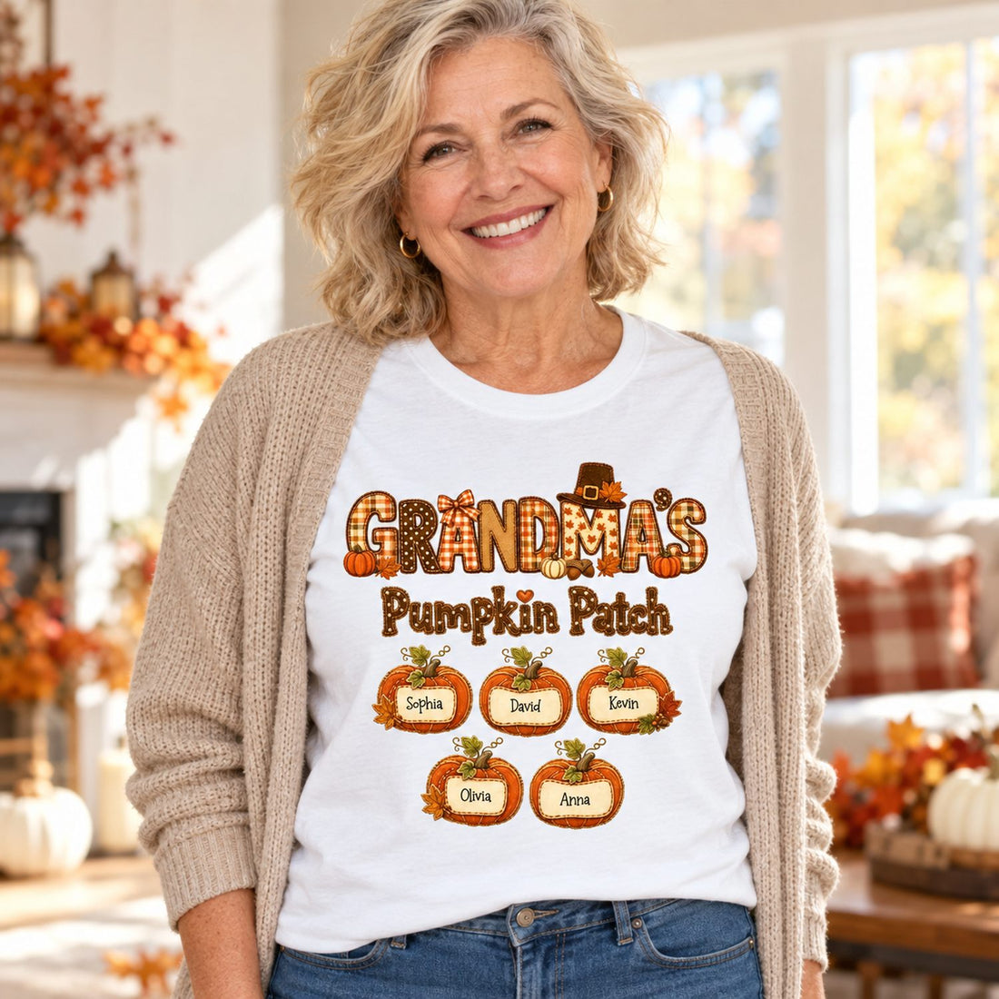 Grandma wearing personalized Grandma's Pumpkin Patch white t-shirt in a bright autumn living room