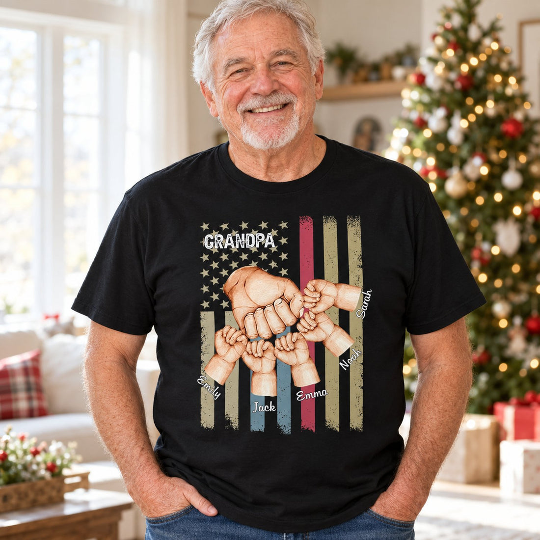 Grandpa wearing personalized Grandpa Fist Bump black t-shirt in a bright holiday living room