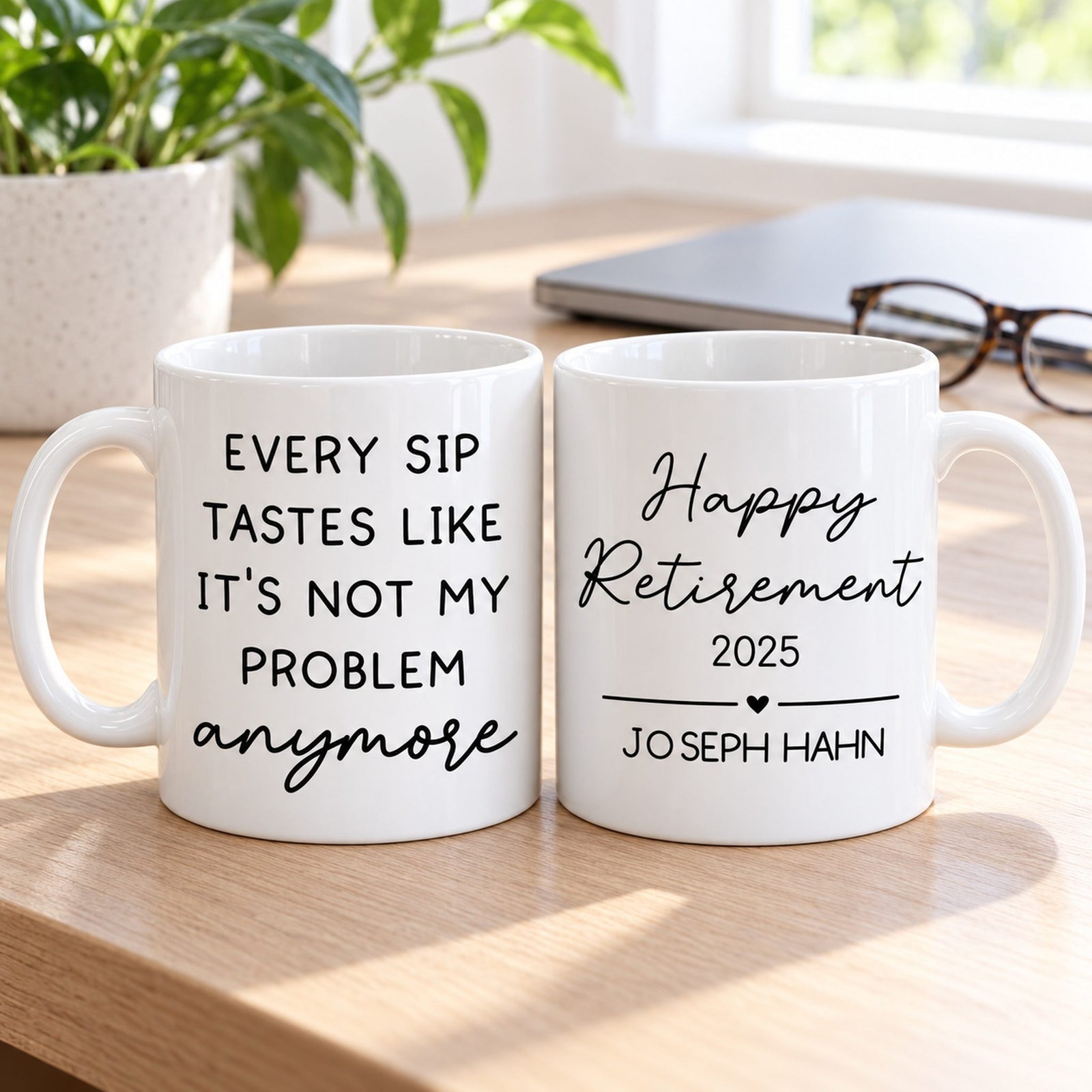 Two-sided Not My Problem Anymore retirement mug next to glasses and laptop for size scale