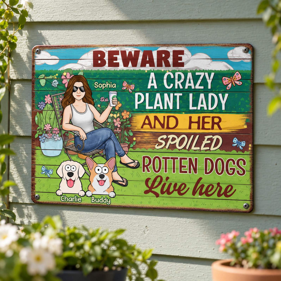 Personalized Crazy Plant Lady and Spoiled Rotten Dogs metal sign mounted on a wooden patio wall with greenery