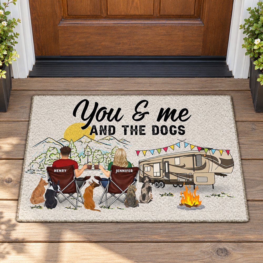 Personalized You And Me And The Dogs RV doormat lying flat at a front porch doorway