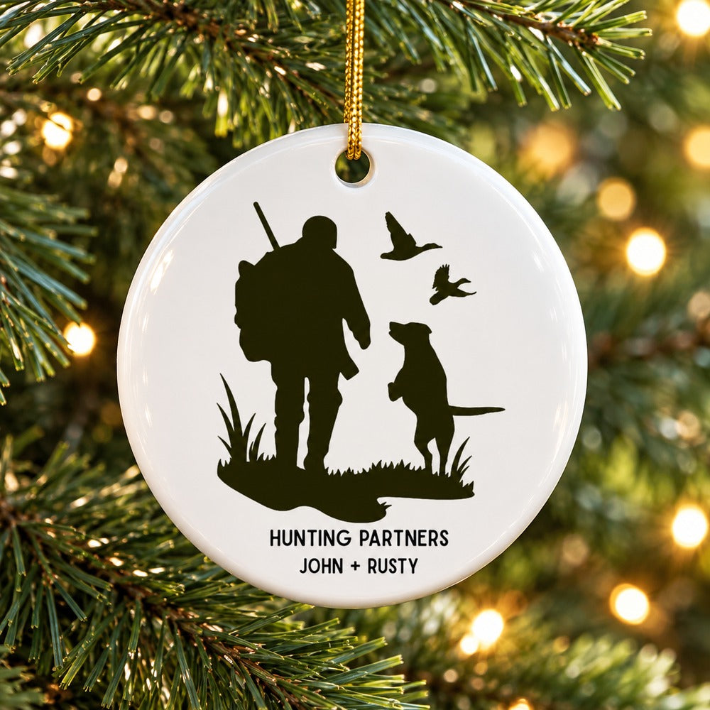 Personalized Hunting Partners ceramic ornament hanging on a Christmas tree branch