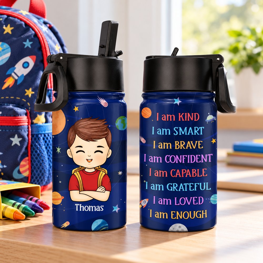 Personalized 12oz kids water bottle next to school backpack and crayons for scale