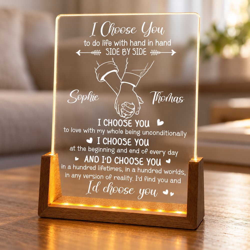 Close-up of engraved acrylic plaque and U-shaped wooden LED base detail