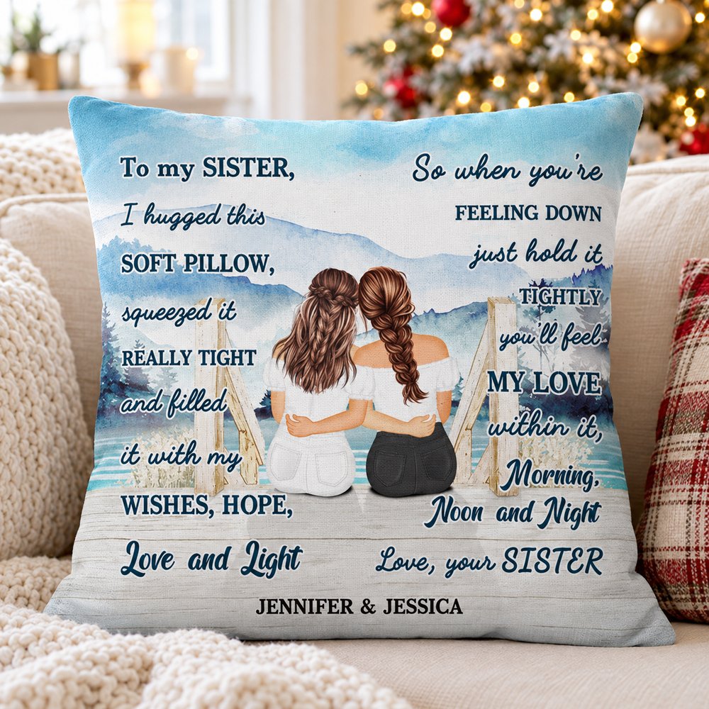 Personalized sister lake pillow on a cozy sofa with Christmas tree lights