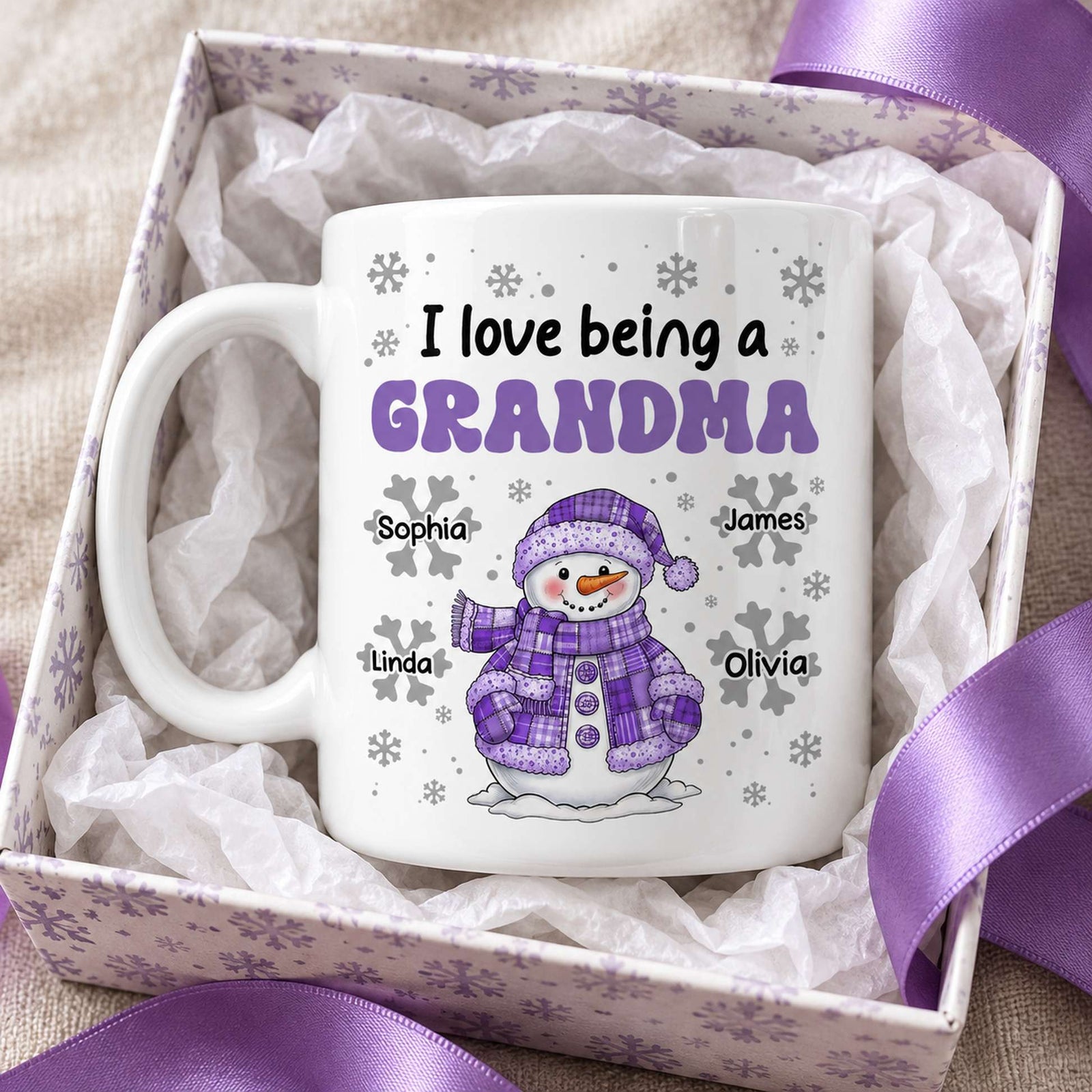 Personalized Grandma snowman mug in a holiday gift box with ribbon and tissue paper