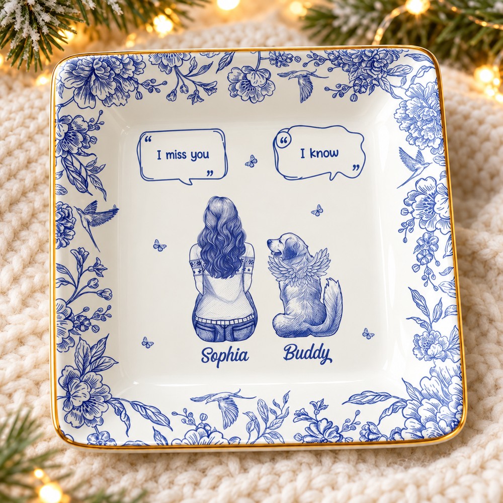 Personalized memorial dog toile jewelry dish on a cozy holiday surface with soft pine and lights