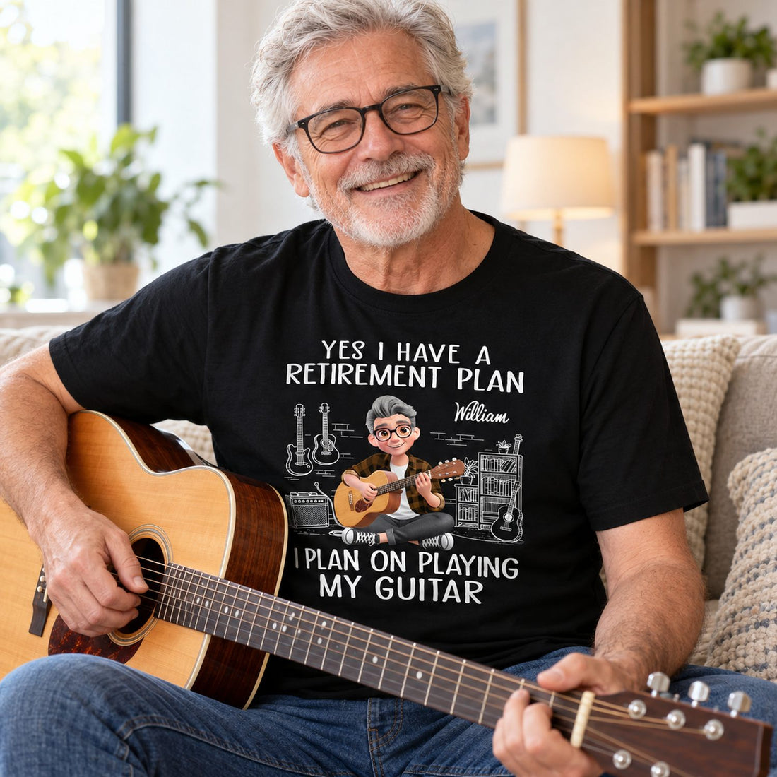 Retired man wearing personalized I Plan On Playing My Guitar black t-shirt holding an acoustic guitar on a sofa
