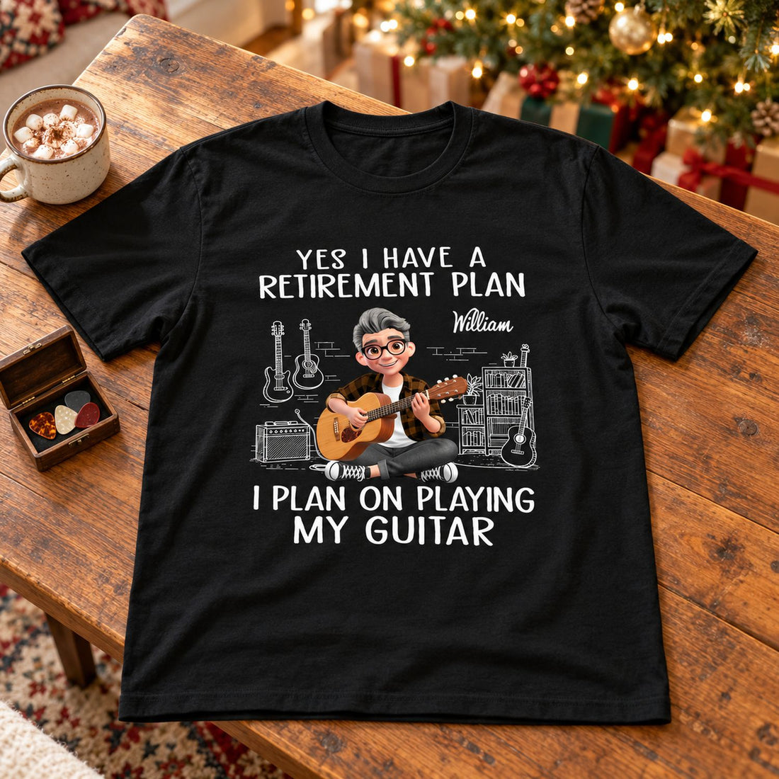 Personalized guitar retirement black t-shirt laid flat on a wooden table with holiday decor in background