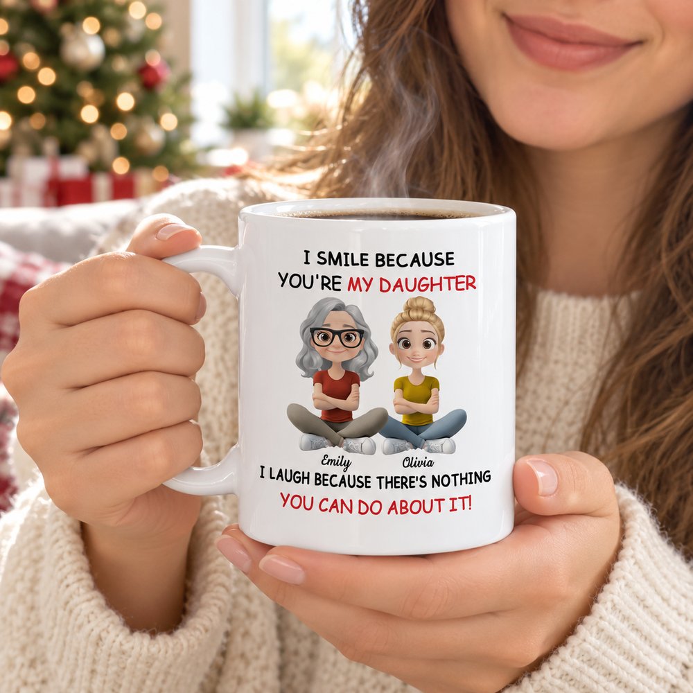 Daughter holding personalized I Smile Because Youre My Daughter white ceramic mug with warm coffee