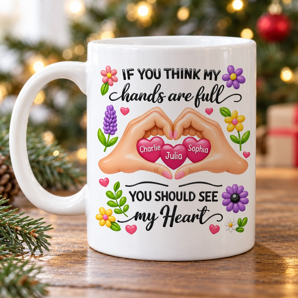 Custom Mother's Day heart hands ceramic mug on wooden table with holiday greenery