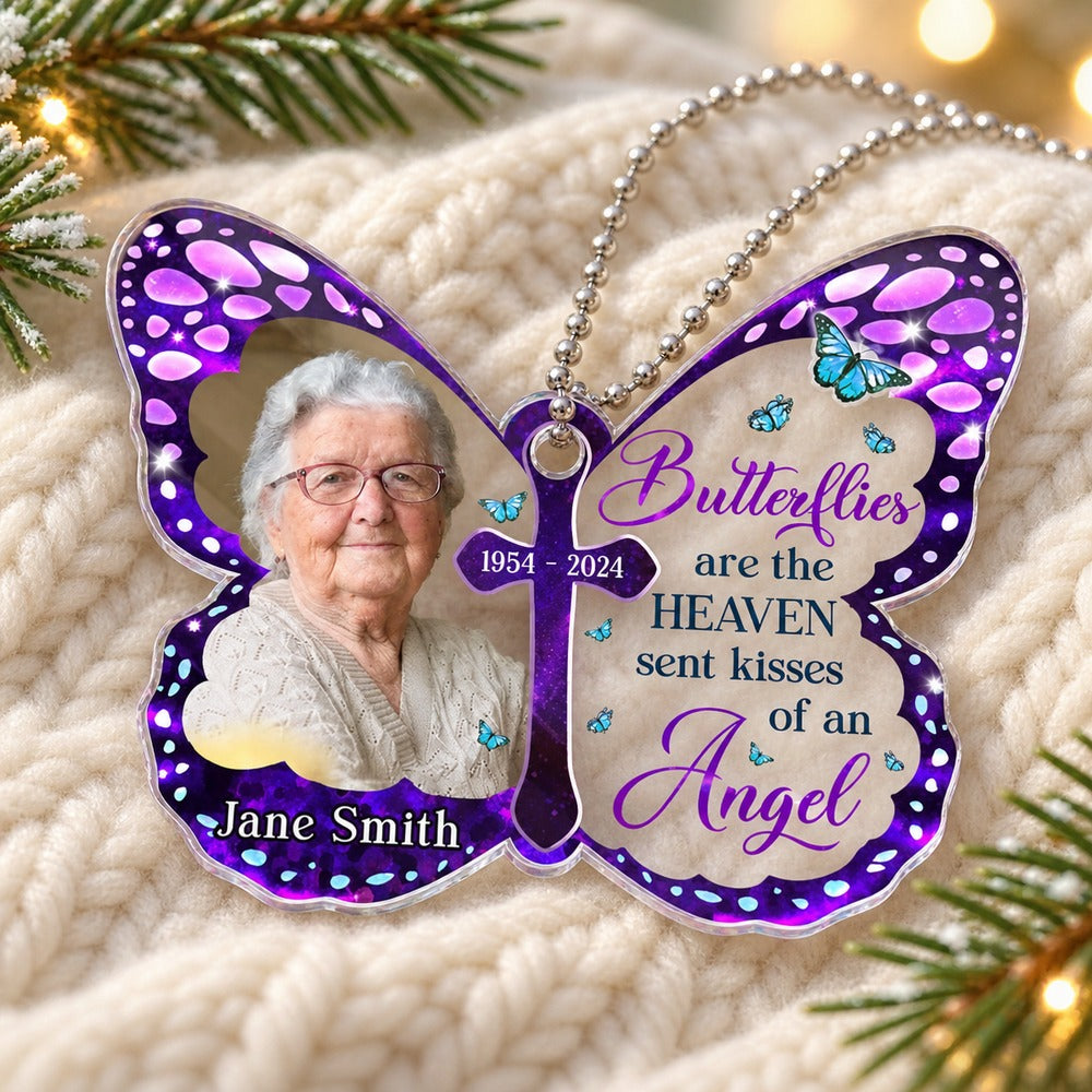 Personalized mom memorial butterfly car hanger lying flat on a cozy cream knit surface with pine