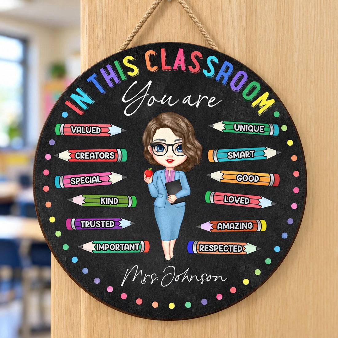 Personalized In This Classroom You Are round wood sign hanging on a wooden classroom door
