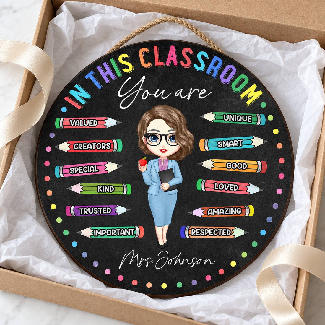 Custom teacher round wood sign nestled in an open gift box with tissue paper
