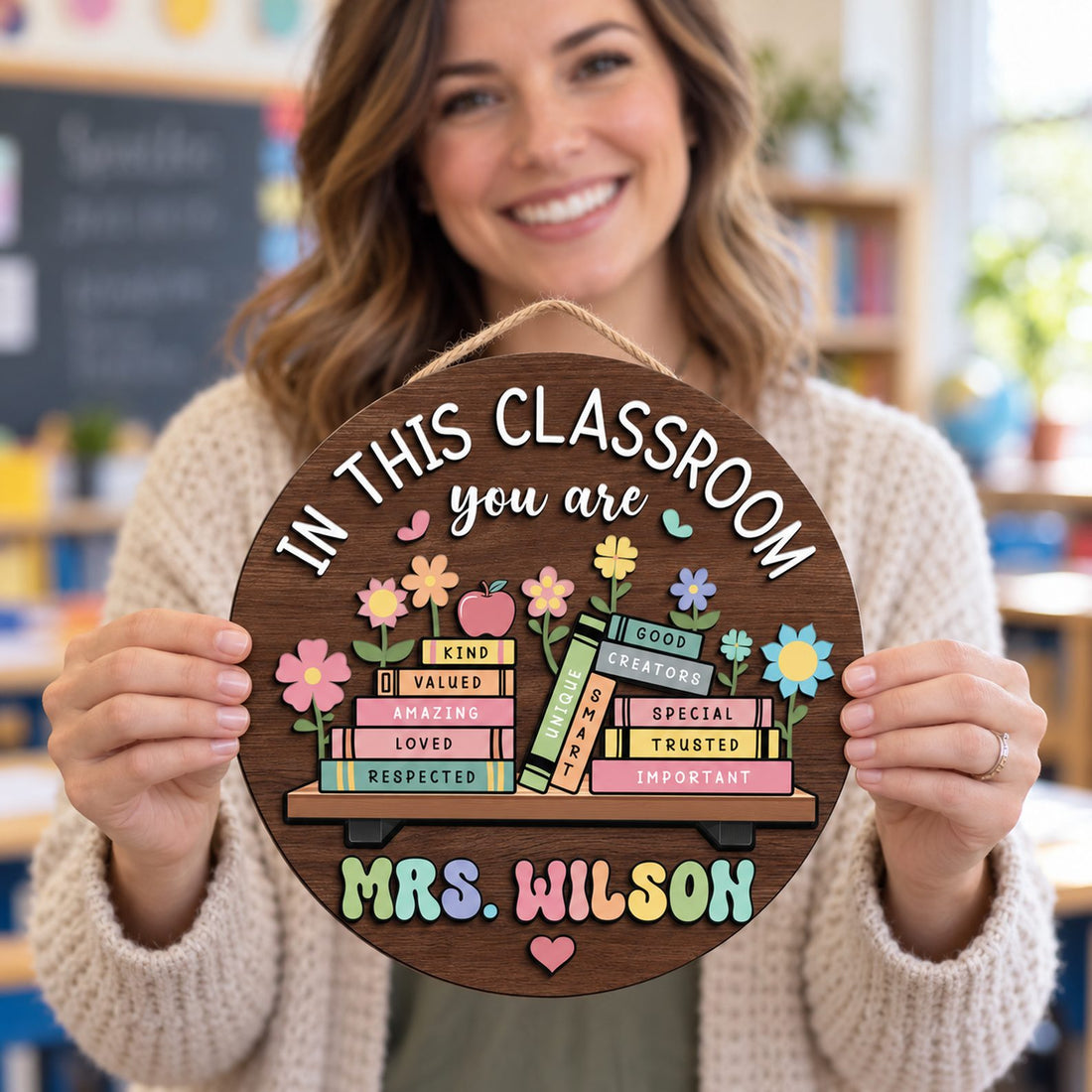 Happy teacher holding her custom In This Classroom You Are round wood door sign