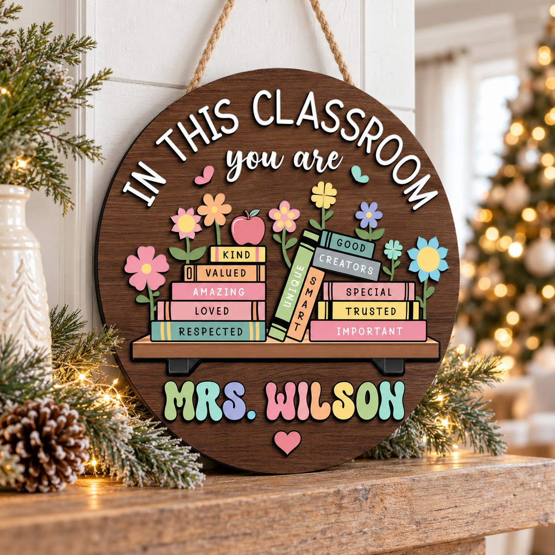Custom teacher round wood sign displayed on a holiday mantel with greenery