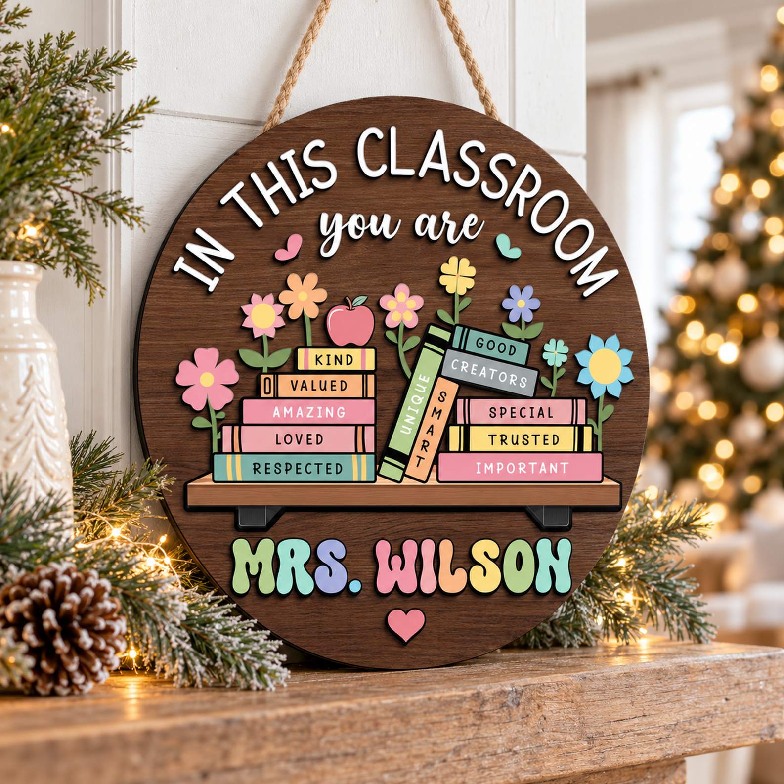 Custom teacher round wood sign displayed on a holiday mantel with greenery