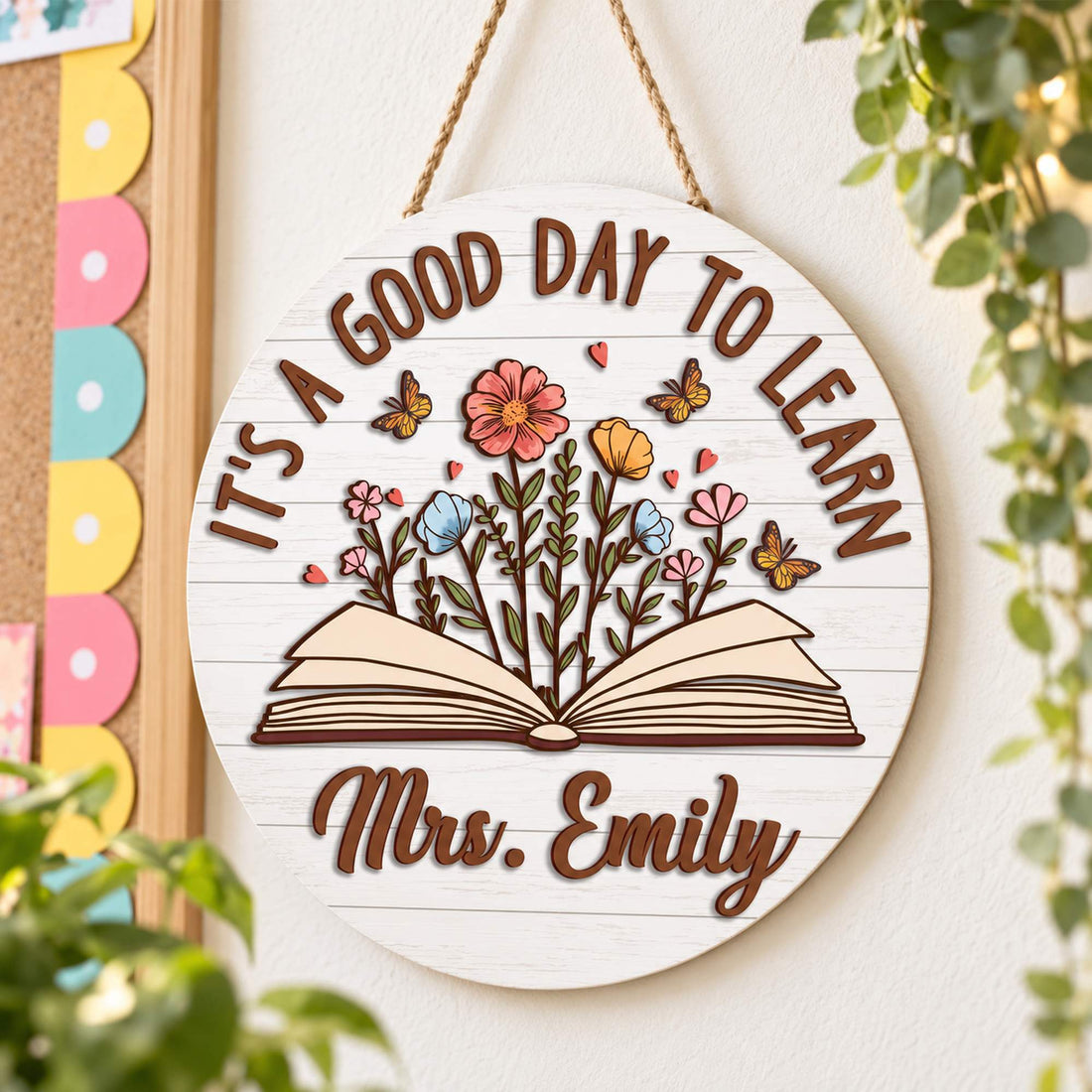 Personalized Mrs. Emily teacher round wood sign hanging on a bright classroom wall