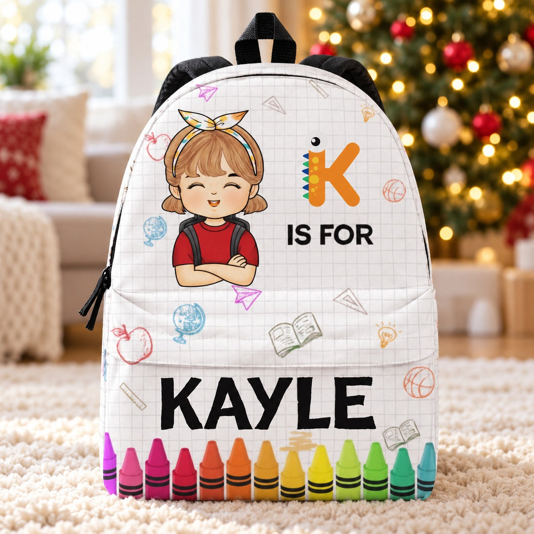 Personalized KAYLE kids backpack standing in front of a softly blurred Christmas tree