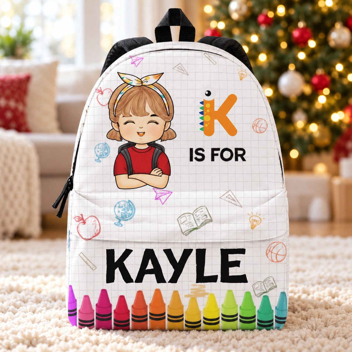 Personalized KAYLE kids backpack standing in front of a softly blurred Christmas tree