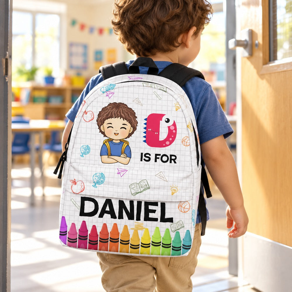 Preschool boy wearing personalized Daniel monster initial backpack walking to school