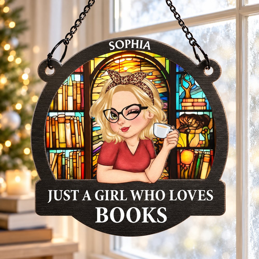 Just A Girl Who Loves Books personalized suncatcher ornament in a bright holiday reading room