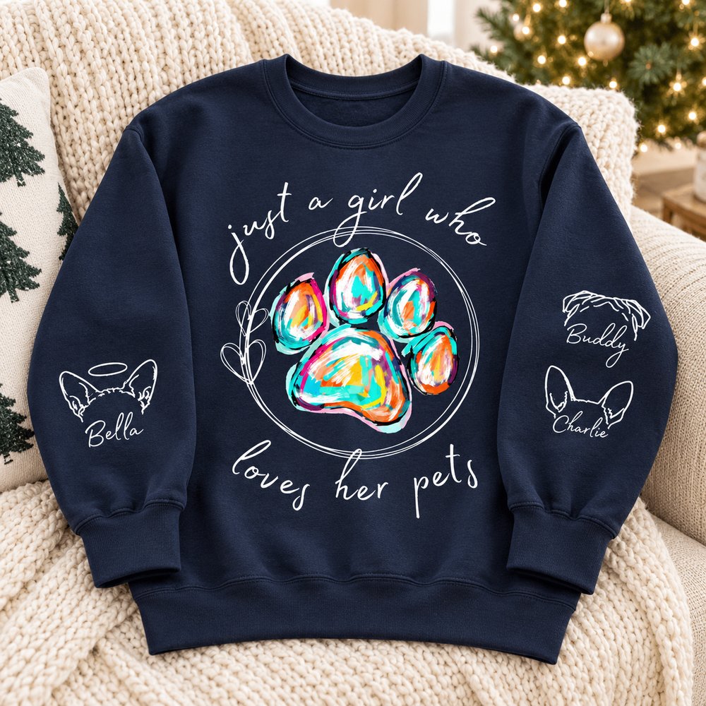 Navy custom dog sleeve printed sweatshirt laid on a cozy sofa near a Christmas tree