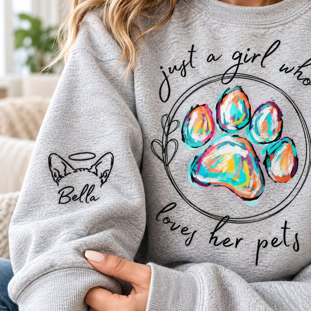 Close-up of digital print texture and custom dog ear design on heather grey sweater sleeve
