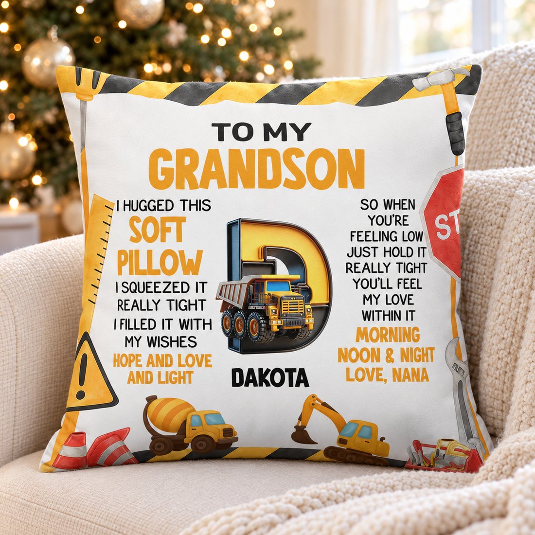 Personalized Grandson construction pillow on a cozy armchair next to a Christmas tree