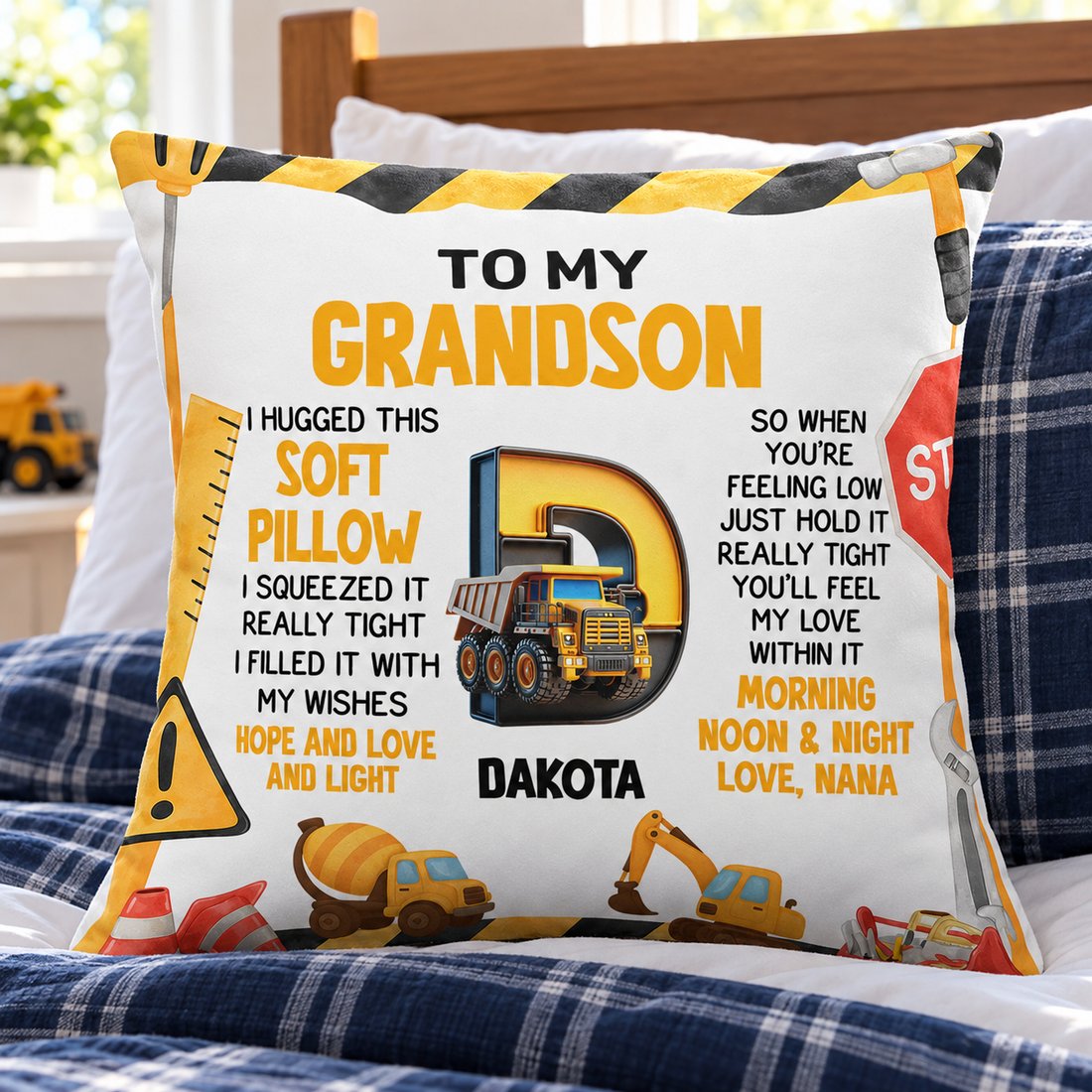 Custom Grandson alphabet pillow displayed on a kids bed with plaid bedding