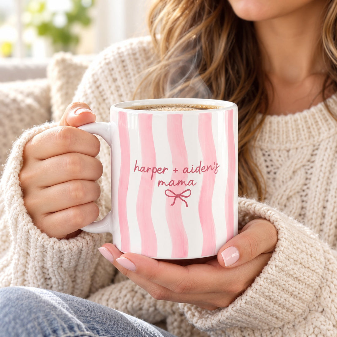Mom holding her personalized pink watercolor striped Mama coffee mug with rising steam