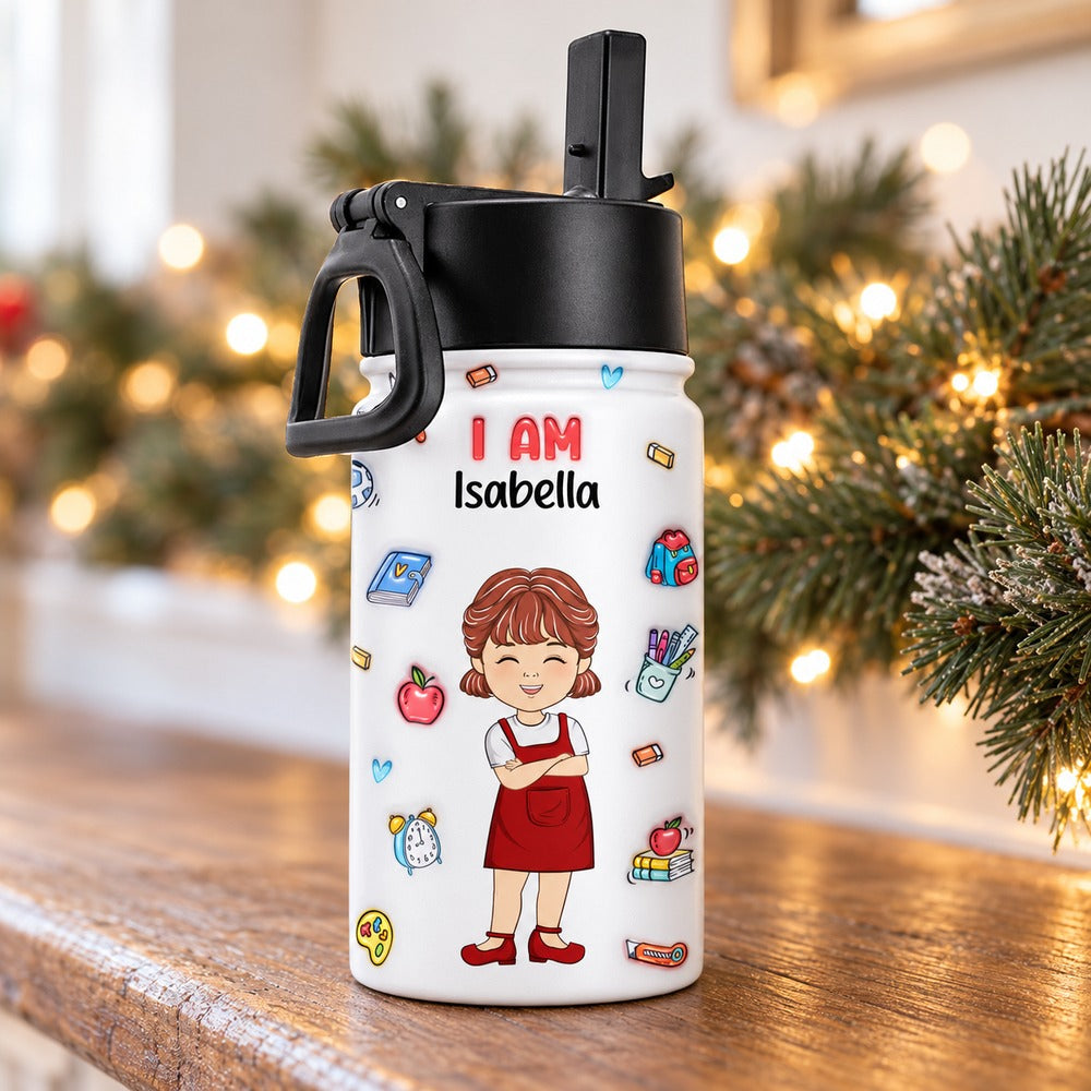 Personalized Isabella kids water bottle standing on a festive holiday mantel