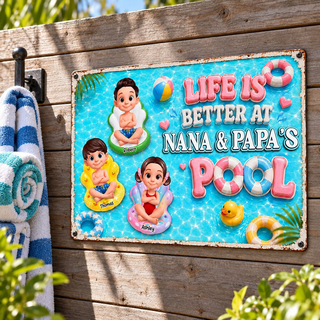 Personalized Nana and Papa pool metal sign mounted on wooden patio wall near pool towels